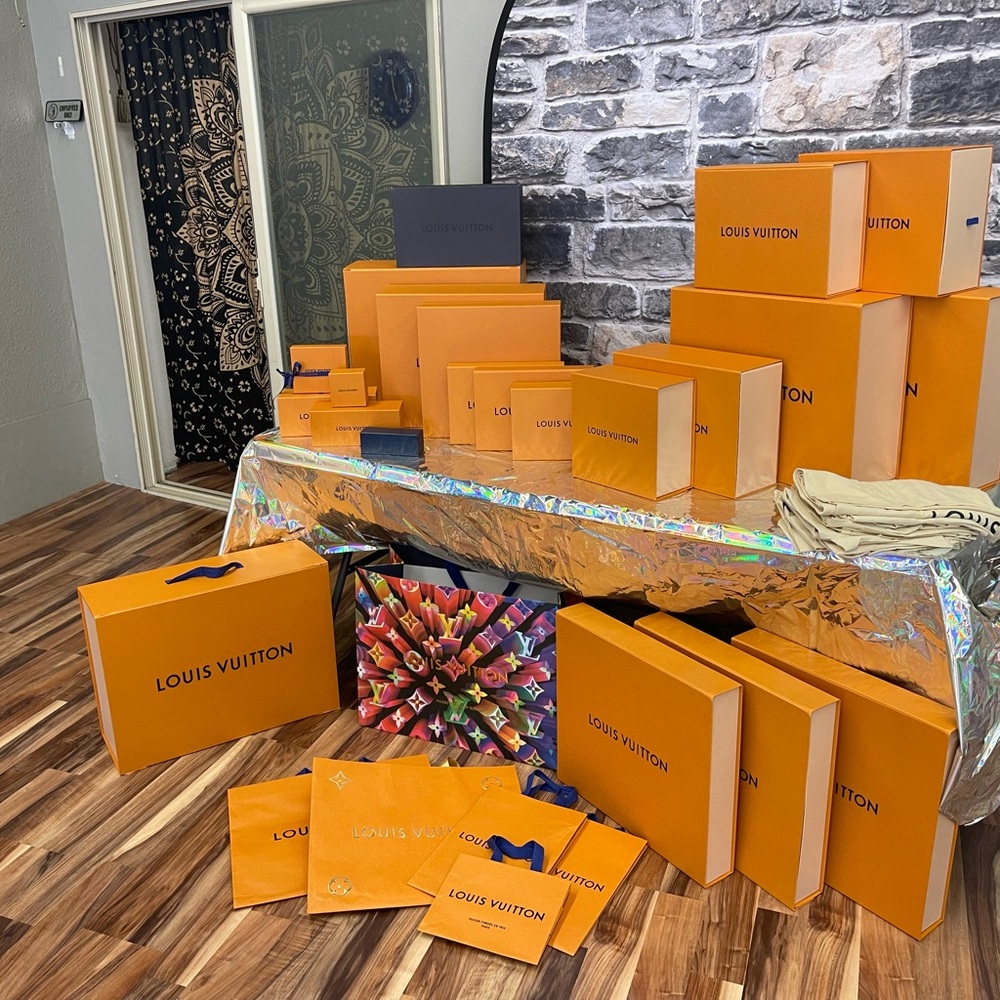 Multiple size Louis Vuitton boxes.